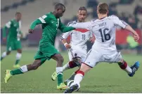  ?? AP ?? Nigeria’s Bernard Bulbwa fights for the ball with Germany’s Robert Bauer and Hany Mukhtar. —