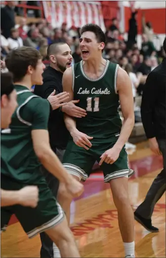  ?? PAUL DICICCO — FOR THE NEWS-HERALD ?? Lake Catholic’s Luka Eller celebrates during the Cougars’ victory over Mentor on Feb. 22.