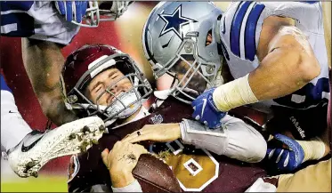  ?? Dallas Cowboys defensive end Tyrone Crawford AP/MARK TENALLY ?? sacks Washington Redskins quarterbac­k Kirk Cousins (8) during the Cowboys’ 33-19 victory Sunday at FedEx Field in Landover, Md. Ezekiel Elliott rushed for 150 yards and 2 touchdowns on 33 carries for Dallas.