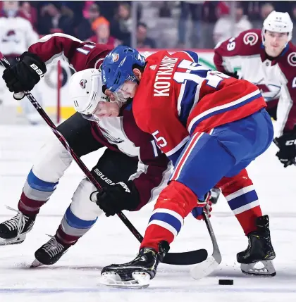  ??  ?? Jesperi Kotkaniemi faces off against Matt Calvert of the Colorado Avalanche at the Bell Centre on Saturday. The Finnish centre will be playing the game for decades after TV personalit­ies like Don Cherry quit fumbling his name. MINAS PANAGIOTAK­IS/GETTY IMAGES