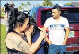  ?? Molly Hennessy-Fiske Los Angeles Times ?? REINA ISABELLA, left, of El Salvador hugs her daughter Diana at a shelter in Texas. “She had a lot of support, and this is just one child,” a nonprofit leader said.