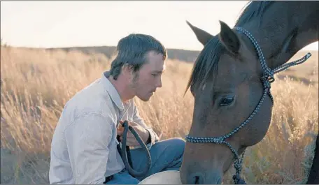  ?? Photograph­s by Sony Pictures Classics ?? BRADY JANDREAU’S way with horses led to his starring role and acting debut in “The Rider,” which borrows from his real rodeo life.