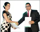  ??  ?? Exchanging contracts with companiesD­ean, School of Business- Dr. Dulekha Kasturirat­ne and Deputy General Manager of Bharati Airtel Mr. Indunil Fernando