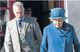  ??  ?? Robert Lovie with the Queen on a royal visit to Ballater after Storm Frank.