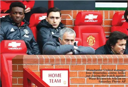  ??  ?? Manchester United manager Jose Mourinho, centre, looks out during the match against West Bromwich Albion on Saturday Photo: AP