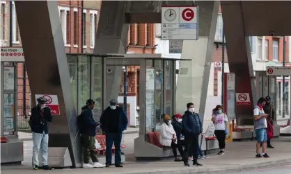  ?? Photograph: Wiktor Szymanowic­z/Barcroft Media/Getty ?? Passengers waiting at Vauxhall bus station, London: greater use of transport services has been reported in the city this week, reflecting the increasing number of people returning to work.