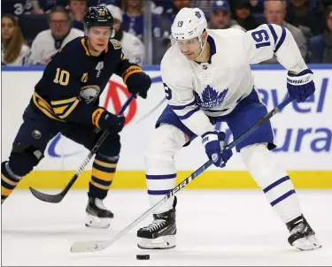  ?? ASSOCIATED PRESS FILE PHOTO ?? Toronto Maple Leafs forward Jason Spezza (19) controls the puck during the second period of the team’s Feb. 16game against the Buffalo Sabres in Buffalo, N.Y. Jason Spezza’s confidence in the NHL returning wasn’t shaken by word of 11players testing positive for the coronaviru­s. Given his involvemen­t in Players’ Associatio­n talks, the veteran Toronto forward knew from doctors’ input that there would be positive test results in hockey just as there have been in other sports as group workouts ramp up across North America.