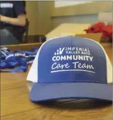 ?? ANDY VELEZ PHOTO ?? Imperial Valley Auto Community Care team showing their logo as they gave away goods and Starbucks discounts to the clients on Friday.