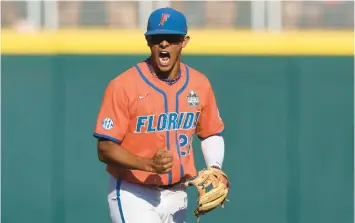  ?? GRATZ/AP ?? Florida shortstop Josh Rivera reacts after an LSU strikeout in Game 3 of the College World Series finals on June 26. Rebecca S.