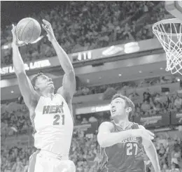  ?? JOE CAVARETTA/STAFF FILE PHOTO ?? Hassan Whiteside, left, will see plenty of help inside if the Heat go with a lineup with Bam Adebayo playing next to him.