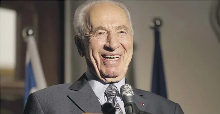  ?? JACK GUEZJACK GUEZ / AFP / GETTY IMAGES ?? This file photo taken on July 14, 2011 shows Israeli President Shimon Peres laughing as he addresses the annual Bastille Day reception at the French ambassador’s residence in Tel Aviv. The former president and Nobel Peace Prize winner and the last of...