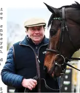  ?? GETTY IMAGES ?? Brave face: Henderson with Altior, now a non-runner