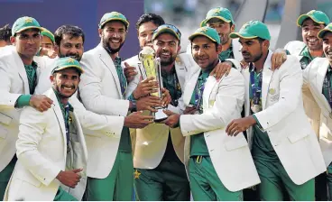  ?? /Reuters ?? Proving a point: Members of the Pakistan team celebrate after beating India at The Oval in London on Sunday.