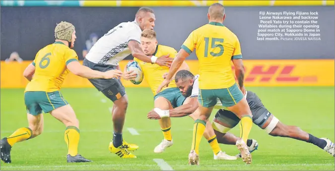  ?? Picture: JOVESA NAISUA ?? Fiji Airways Flying Fijians lock Leone Nakarawa and backrow Peceli Yato try to contain the Wallabies during their opening pool match at Sapporo Dome in Sapporo City, Hokkaido in Japan last month.