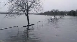  ??  ?? In at the deep end Flooding in Lochwinnoc­h