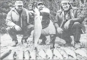  ?? FILE ?? Hantsport’s Ken Sears, left, and Laurie Crowell, were all smiles in 1993 when they went on a fishing trip to Hickson Lake in northern Saskatchew­an. Pictured with them is their fishing guide. Some of the trout caught were as big as 12 pounds.