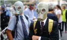 ??  ?? Student activists wear gas masks during the strike in Sydney. Photograph: Steven Saphore/AAP