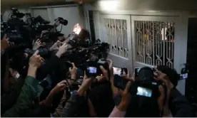  ?? ?? Members of the media stand outside Stand News during a raid by police at the independen­t news outlet in Hong Kong, China, Photograph: Anthony Kwan/Getty