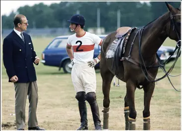  ??  ?? TALKING TACTICS Prince Charles and his father, pictured at Windsor in 1975, shared a love of polo