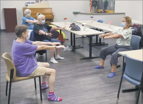  ?? BEN HASTY — READING EAGLE ?? Barbara Mills, right, Body Recall instructor, leads the exercise class at Berks Encore. Front to back are Eva Beears, Elaine Hartman and Peg Wrede.