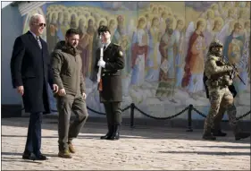  ?? EVAN VUCCI — THE ASSOCIATED PRESS ?? President Joe Biden, left, walks with Ukrainian President Volodymyr Zelenskyy at St. Michaels Golden-domed Cathedral during an unannounce­d visit in Kyiv, Ukraine, on Monday.