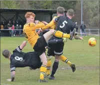  ??  ?? Jack Lingard is crowded out by Brora defenders