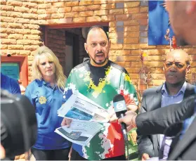  ?? Picture: Michel Bega ?? UNITED STAND. Yusuf Abramjee, centre, with former Gauteng community police forum chairperso­n Andy Mashaile, right, and Laudium CPF representa­tives Adila Alli, left, yesterday.