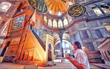  ?? AFP ?? A man prays at Hagia Sophia in Istanbul, once the holy centrepiec­e of Byzantine Christiani­ty.