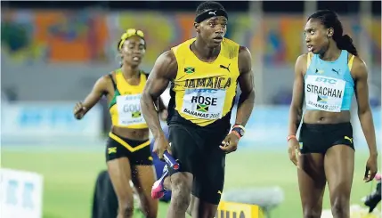  ?? GLADSTONE TAYLOR ?? Jamari Rose collects the baton from Natoya Goule in the mixed 4x400m relay finals at the 2017 World Relays in the Bahamas.