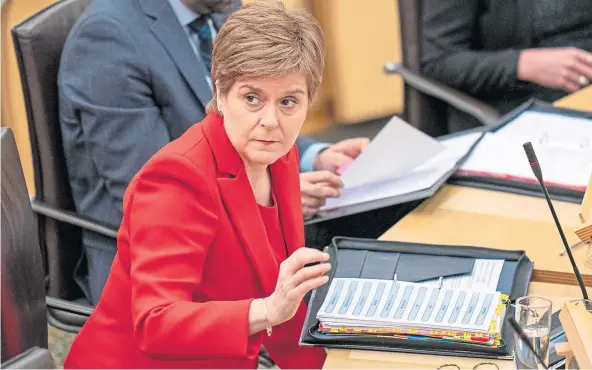  ?? ?? ANSWERS: First Minister Nicola Sturgeon in the chamber of the Scottish Parliament during First Minister’s Questions yesterday.