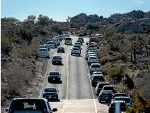  ?? WASHINGTON POST ?? Heavy traffic stacks up near Skull Rock in Joshua Tree National Park. The federal government shutdown meant visitors have driven offroad and parked illegally.