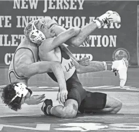  ?? PETER ACKERMAN ?? St. John Vianney’s Anthony Knox, right, became the 32nd three-time champion in NJSIAA history and is the Asbury Park Press’ Shore Conference Wrestler of the Year.