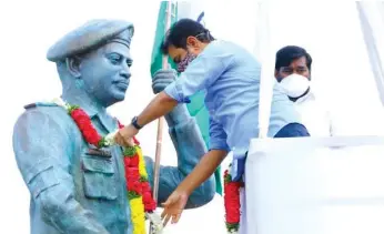  ?? — DC ?? IT minister K.T. Rama Rao garlands the statue of Galwan hero Colonel Santhosh Babu on the first anniversar­y of his martyrdom at Suryapet on Tuesday. Energy minister Jagdish Reddy could also be seen in the picture.