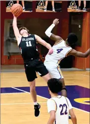  ?? FILE PHOTO/RON HARAMIA ?? Glenn’s Joe Chrapliwy (left) goes up high and backwards to snare this rebound against SB Clay. The Falcons host SB Riley Thursday night in NIC action.