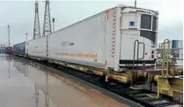  ??  ?? European loading-gauge intermodal wagons loaded with high-cube refrigerat­ed containers at DB Cargo's Barking terminal in east London. DB CARGO UK