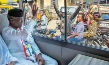  ??  ?? Vice President Yemi Osinbajo acknowledg­es cheers from cyclists during his community engagement to seek support for President Muhammadu Buhari’s re-election in Lagos Photos:VP’sOffice