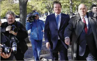  ?? ALEX BRANDON / ASSOCIATED PRESS ?? Paul Manafort, former campaign manager for President Donald Trump, leaves federal court in Washington, D.C., on Monday. Manafort and another Trump campaign associate were indicted Monday in the first actions brought by special counsel Robert Mueller.