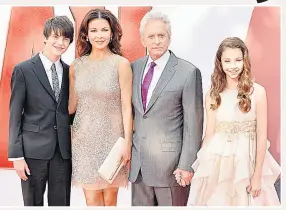  ??  ?? ACTING DYNASTY Catherine with husband Michael and children Dylan and Carys