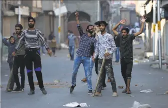  ?? Mukhtar Khan / Associated Press ?? Kashmiri protesters in the city of Srinagar shout slogans during a demonstrat­ion over braid theft incidents by unidentifi­ed assailants in many parts of the disputed Himalayan region.