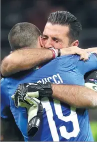  ?? LUCA BRUNO / AP ?? Gianluigi Buffon is consoled by teammate Leonardo Bonucci after Italy’s World Cup failure against Sweden.