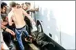  ?? SELCUK SAMILOGLU/AFP AFP ?? People beat a soldier on the ground after taking over a military position on the Bosphorus bridge in Istanbul on July 16.