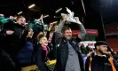  ?? Photograph: Steven Paston/PA ?? Cray Valley manager Steve McKimm celebrates with a replica of the FA Cup after holding Charlton to a 1-1 draw at The Valley.