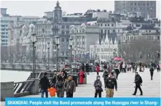  ?? ?? SHANGHAI: People visit the Bund promenade along the Huangpu river in Shanghai on March 6, 2024. — AFP