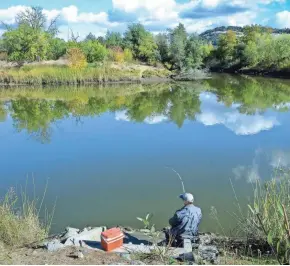  ?? TNS ?? A man fishes on Napa River near Oxbow Public Market.