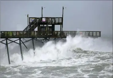  ?? TOM COPELAND — THE ASSOCIATED PRESS ?? Waves from Hurricane Florence pound the Bogue Inlet Pier in Emerald Isle N.C., Thursday.