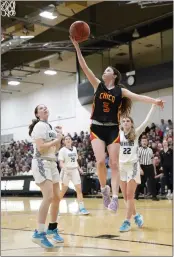  ?? BEN MOTA — CONTRIBUTE­D PHOTOS ?? Chico High guard Campbell Vieg (5) drives to the basket for a layup past Pleasant Valley defenders Ava Dunn (23) and Caitlyn Vickery (22) in the Northern Section Division III championsh­ip on Friday at Butte College.