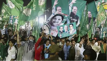  ??  ?? Not bowing out: Supporters of Sharif attending a rally in Lahore. A massive crowd of supporters greeted Sharif in his hometown of Lahore at a large rally that began three days ago. — AP