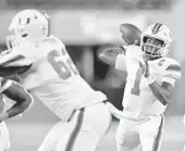  ?? JAMIE RHODES/COURTESY ?? Hurricanes QB D’Eriq King (1), shown in September, did it all against N.C. State.