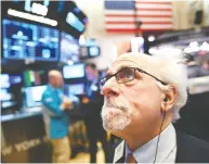  ?? JOHANNES EISELE / AFP VIA GETTY IMAGES FILES ?? A traderat the New York Stock Exchange. Bad markets are a necessary part of investing so you might as well
get good at them, Tom Bradley writes.