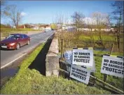  ?? Peter Morrison Associated Press ?? A CAR CROSSES the Irish border in Middletown, Northern Ireland, this week. How to manage the border is a major issue in the Brexit negotiatio­ns.